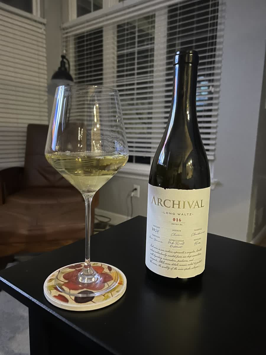 A glass of Long Waltz Chardonnay, Entry No. 016, poured at home